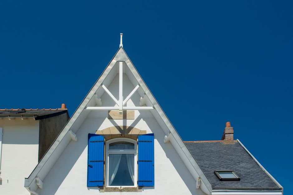 Professional roofing contractor working on residential home exterior